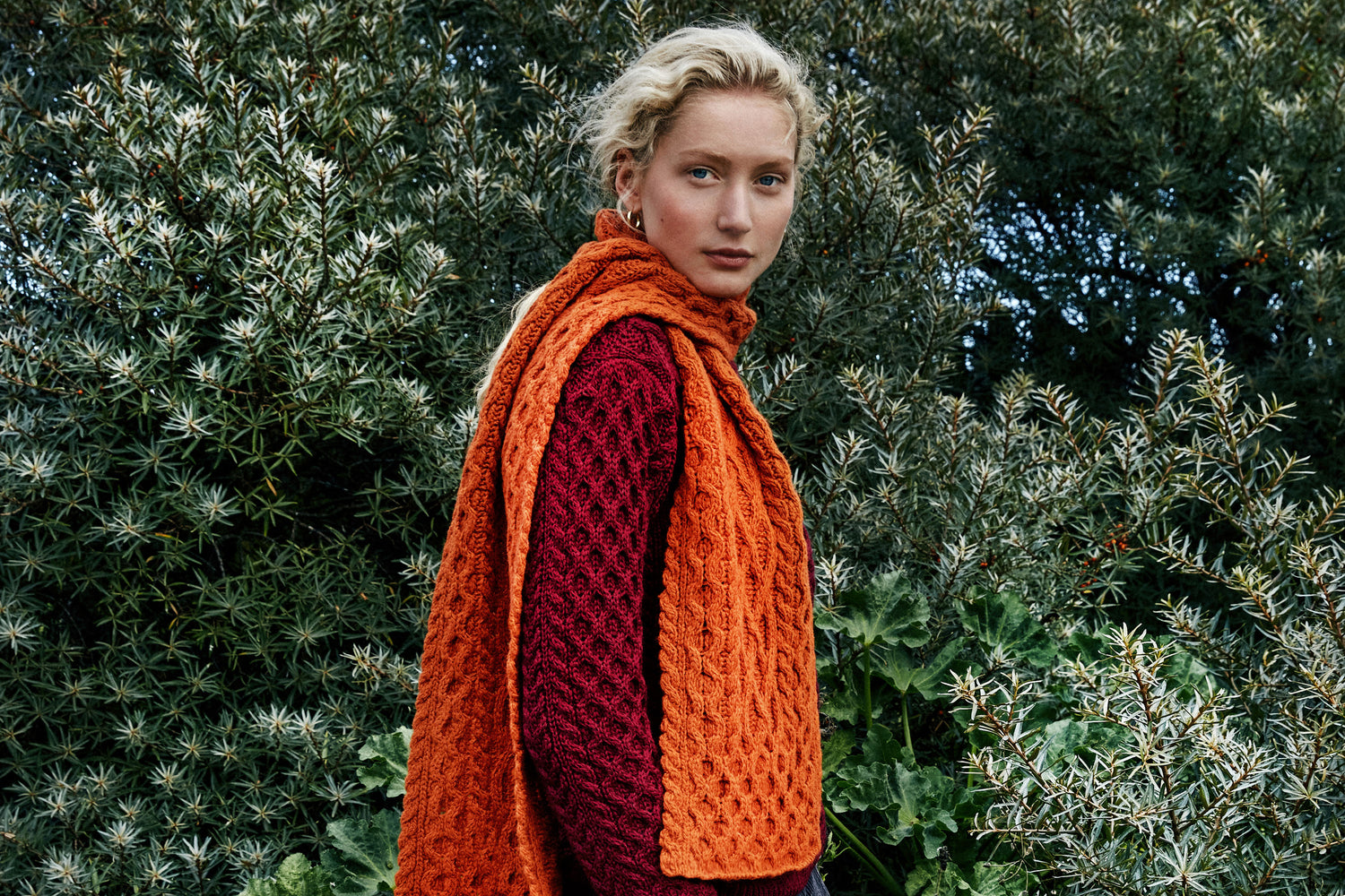 IrelandsEye Knitwear Blasket Honeycomb Stitch Aran Sweater in Claret and Luxe Aran Scarf in Terracotta