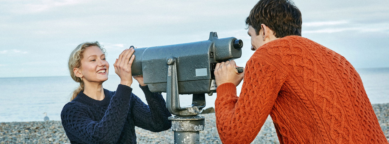 IrelandsEye Knitwear Blasket Honeycomb Stitch Aran Sweater in Navy Merino and Carraig Luxe Aran Sweater in Terracotta