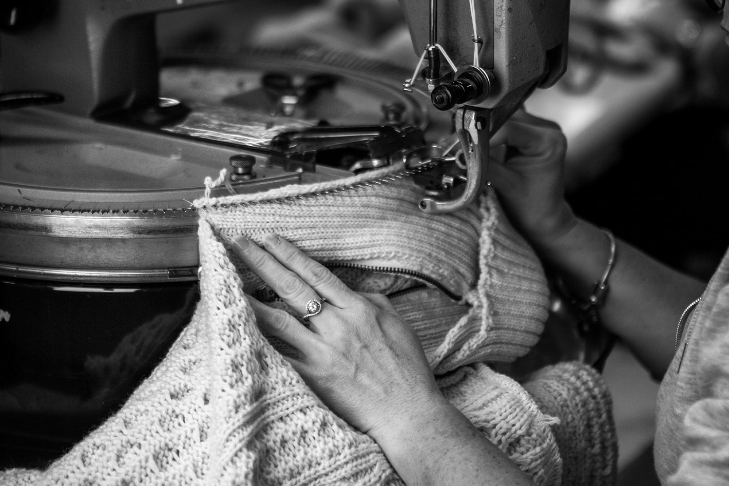 Hands using the linking machine in the factory 