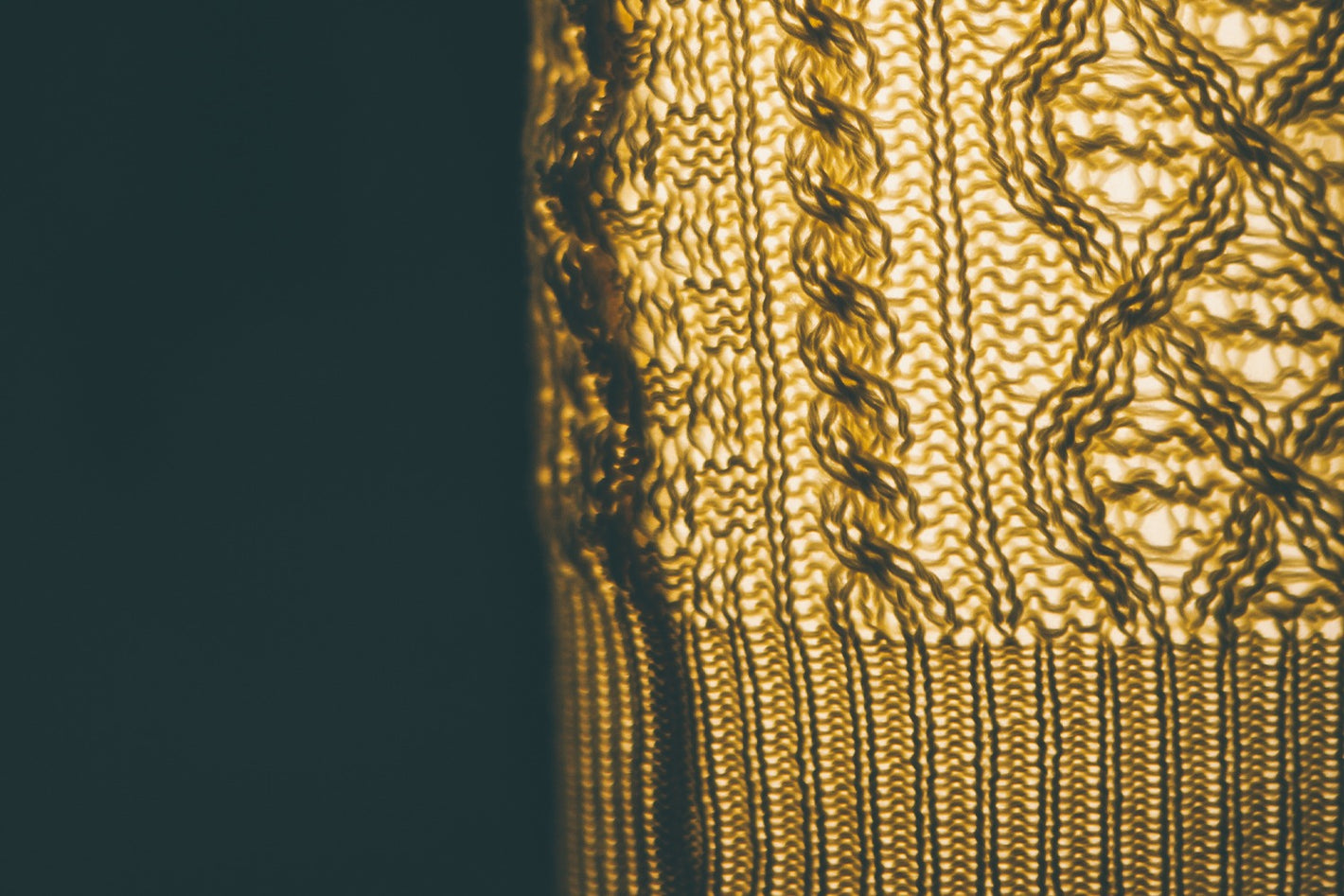 Close-up of a textured gold surface with intricate patterns