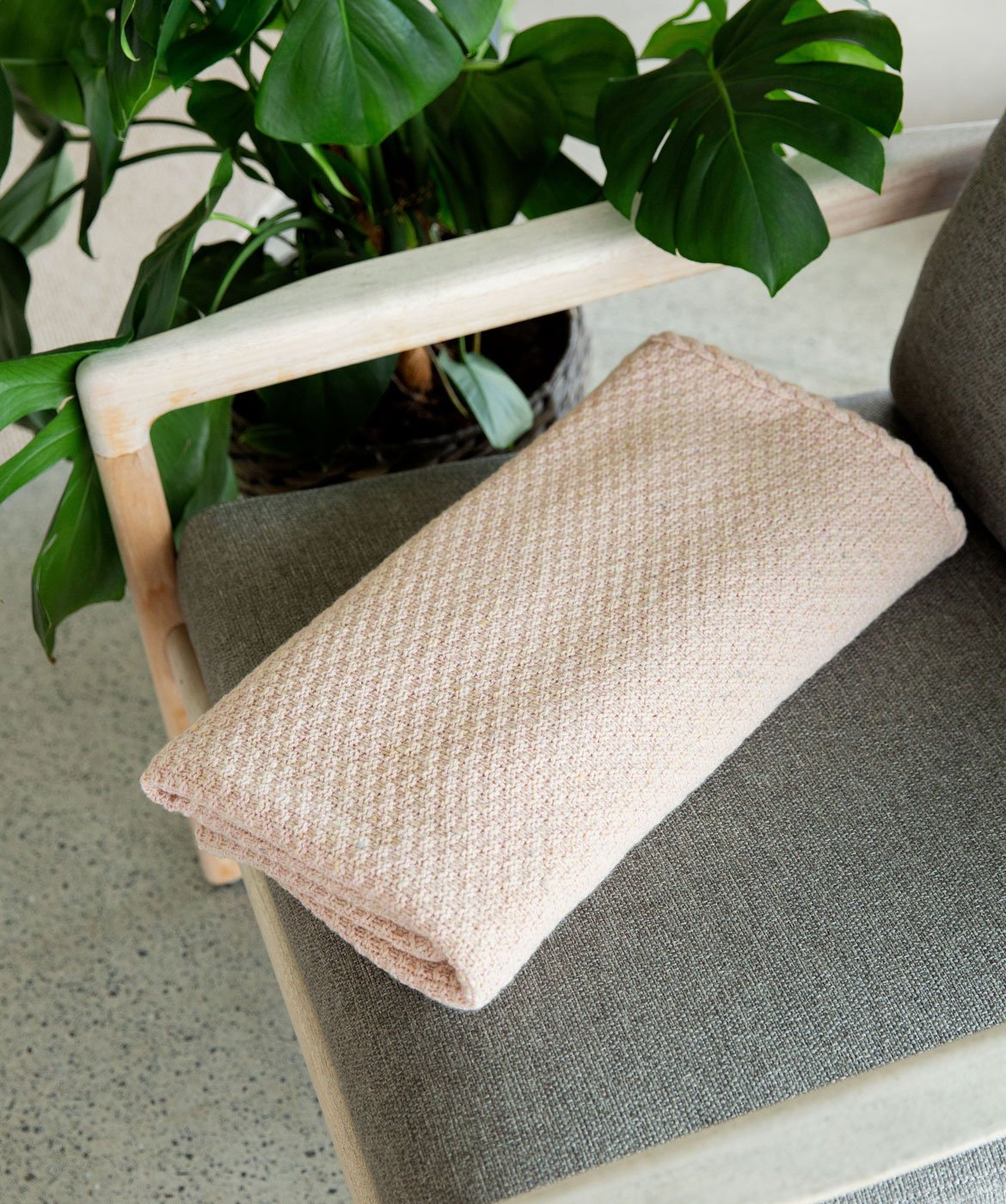 Moss Textured Throw in Opal Pink Donegal Luxe Melange